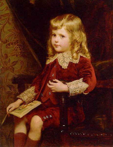 Portrait of a young boy in a red velvet suit